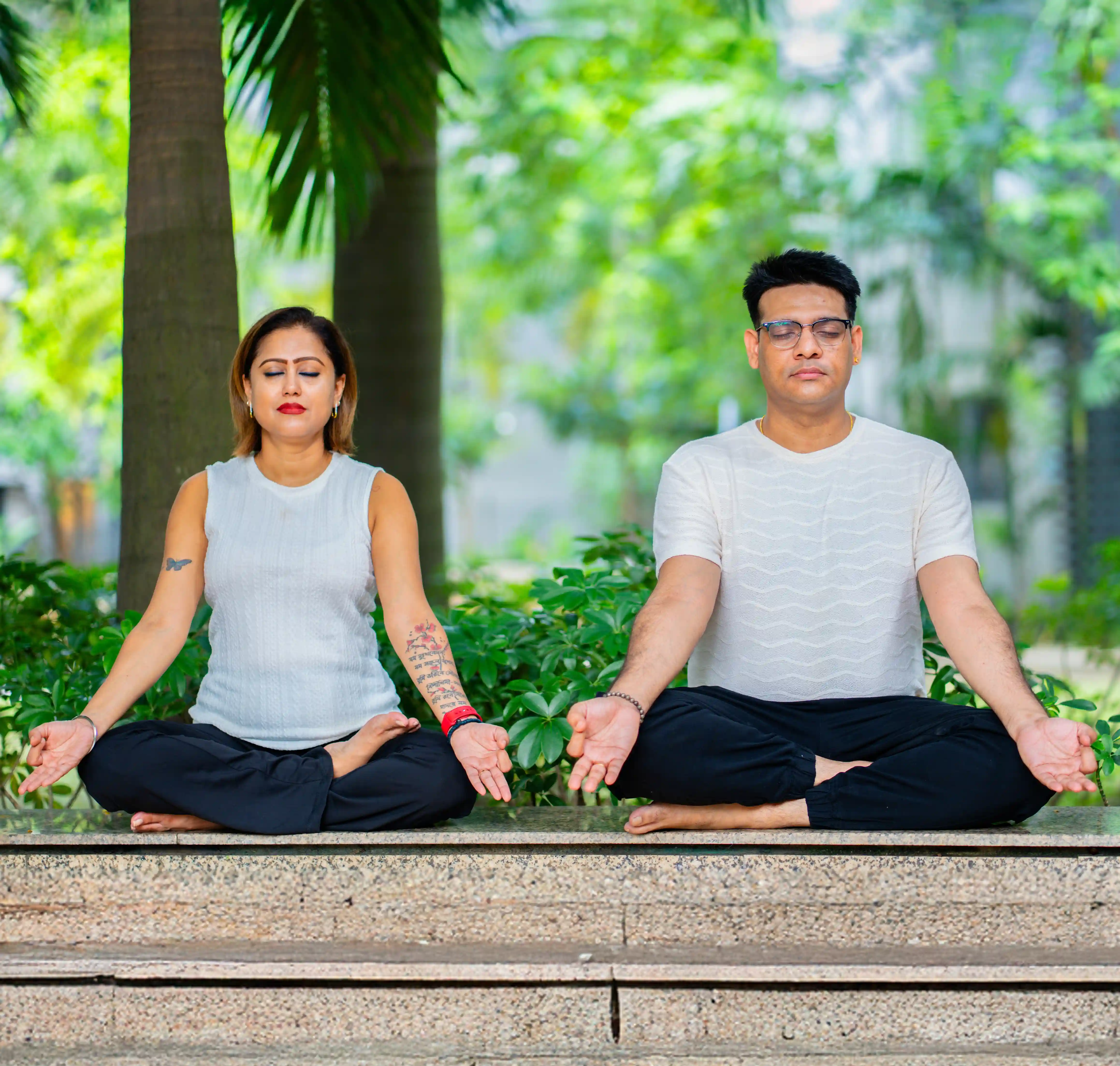 A student practicing yoga exercises at home following a yoga beginners course guided by Gaurav Tribedi of Nabatara Institute.